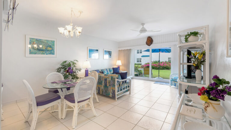 First floor Villa 3, Grand Cayman Condo Rental: Living and dining room overlooking gardens and patio